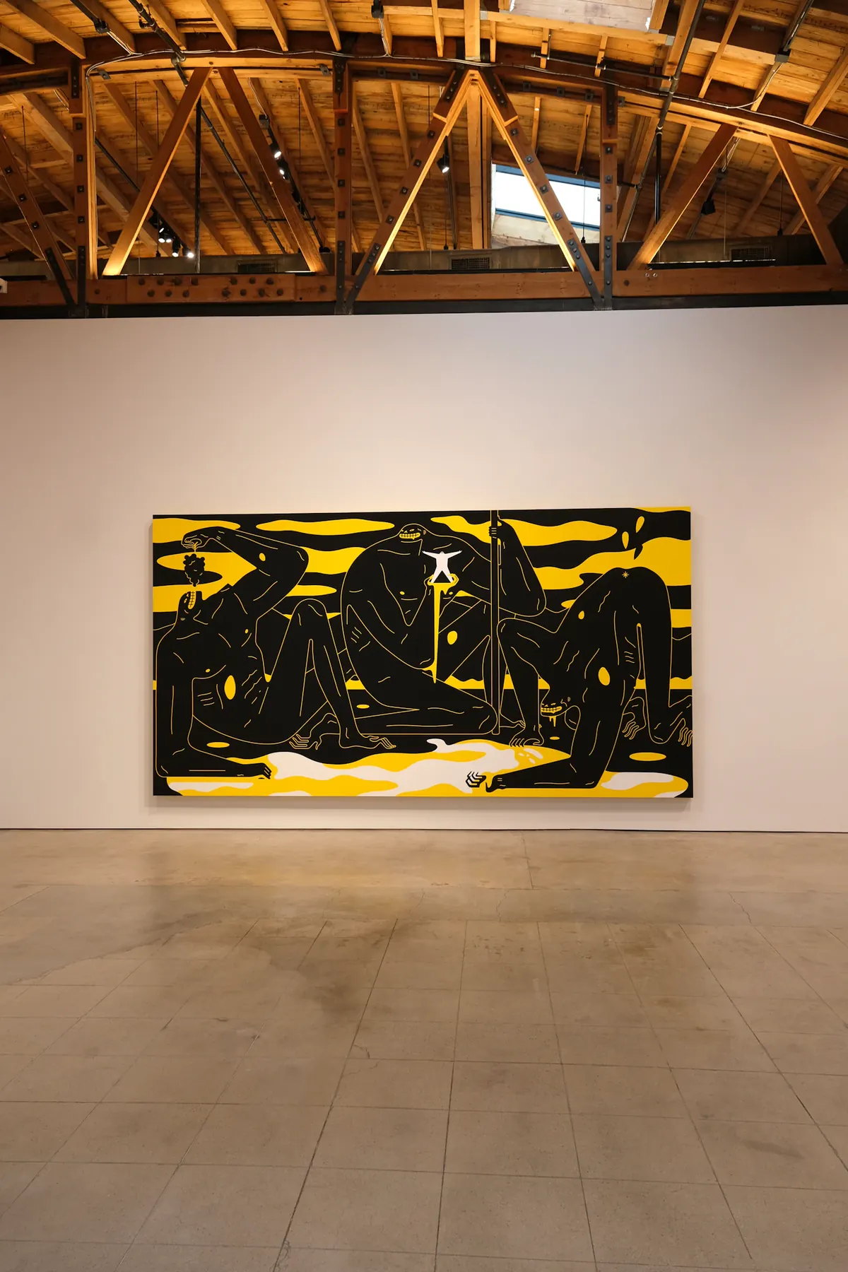 A black-and-yellow Cleon Peterson work displayed in a Culver City gallery