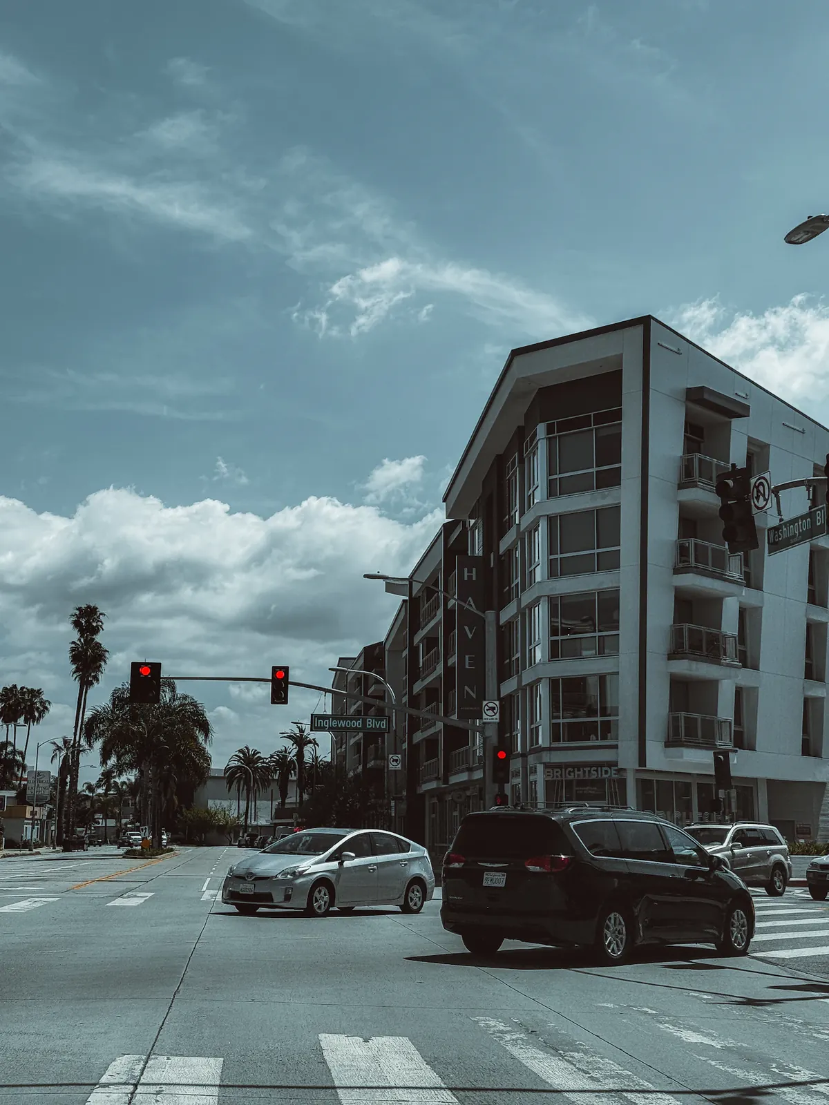 A downtown Culver City intersection beneath a dramatic sky