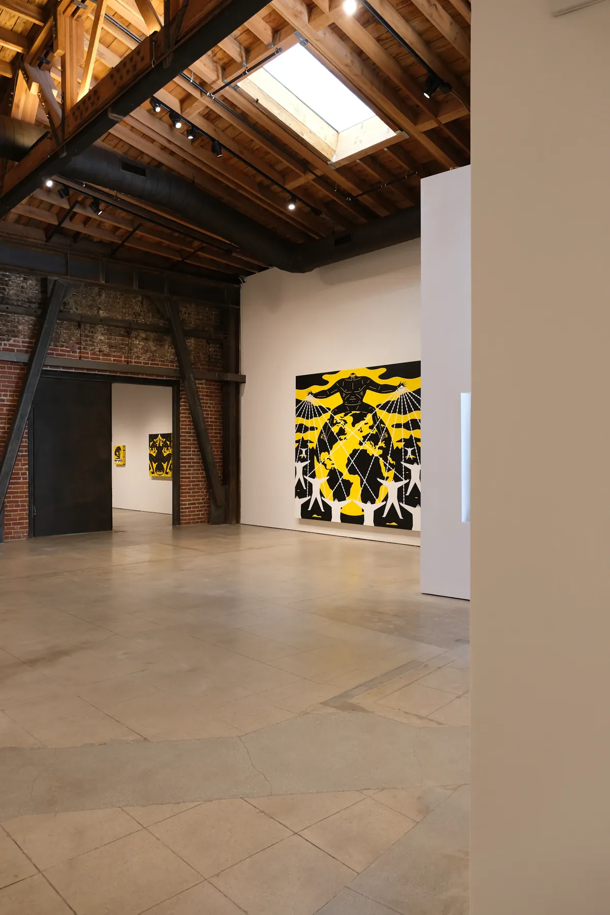 A contemporary artwork at the end of a timber-roofed Culver City gallery