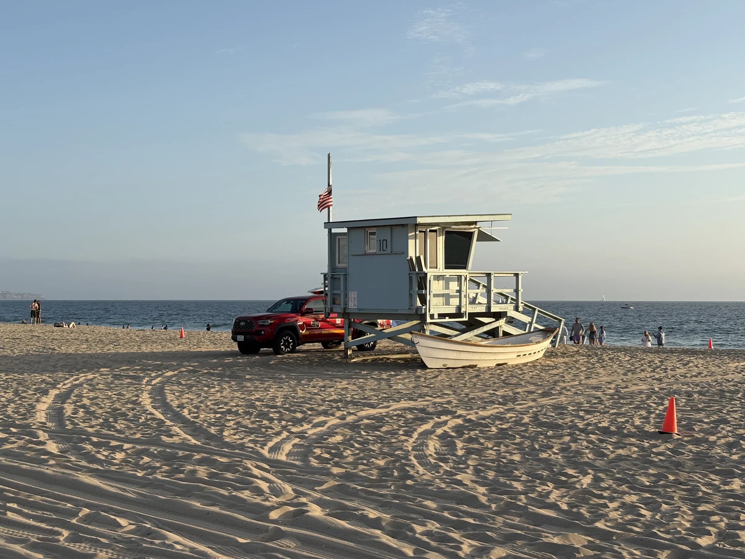 A Hermosa Beach lifeguard tower beside calm Pacific water