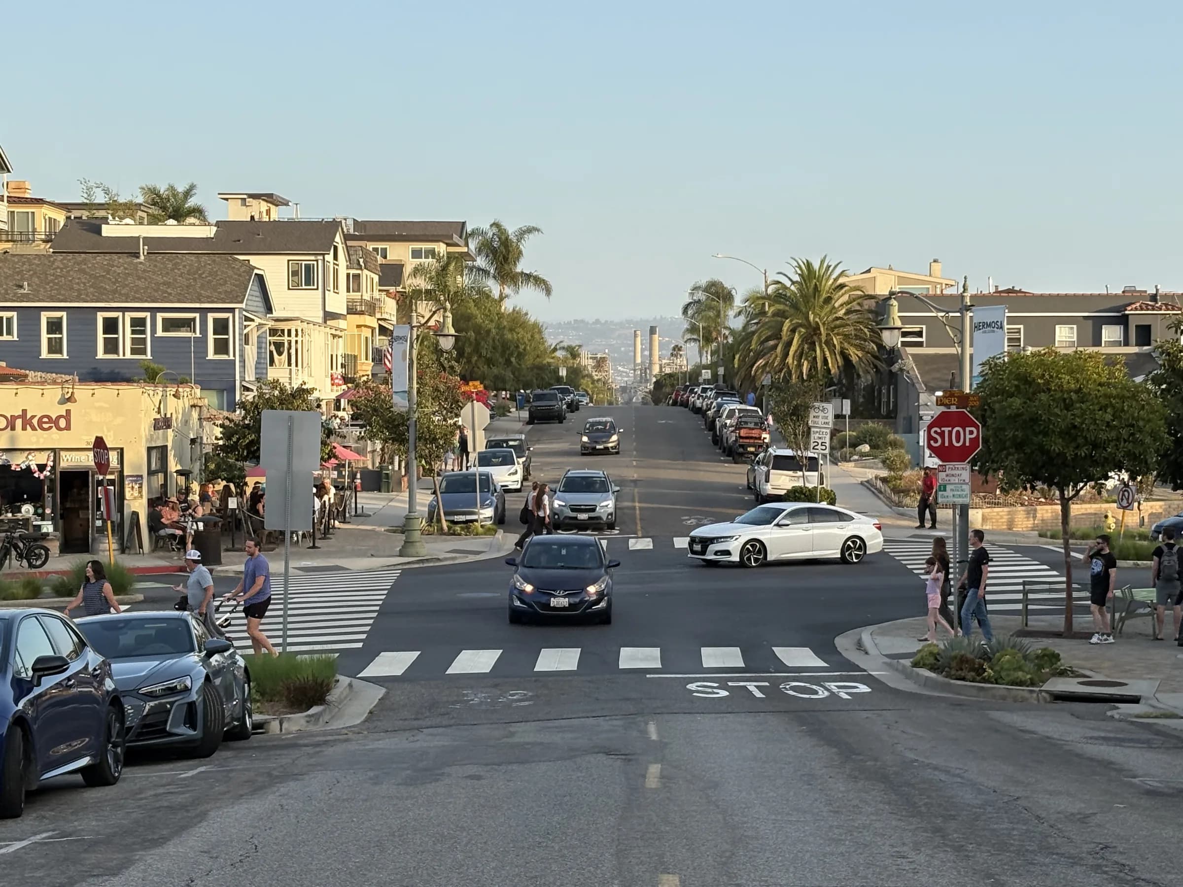 A walkable Hermosa Beach intersection surrounded by homes and local businesses