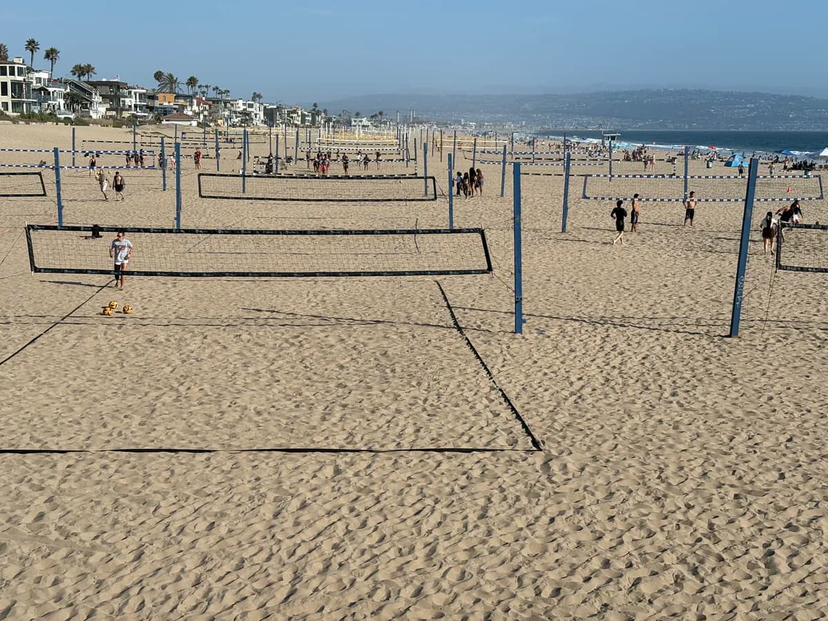 Beach volleyball courts across the sand in Manhattan Beach