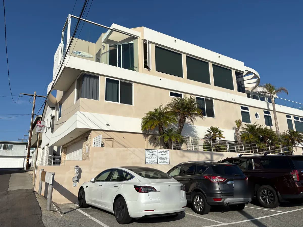 Modern white home on a sunny Manhattan Beach street