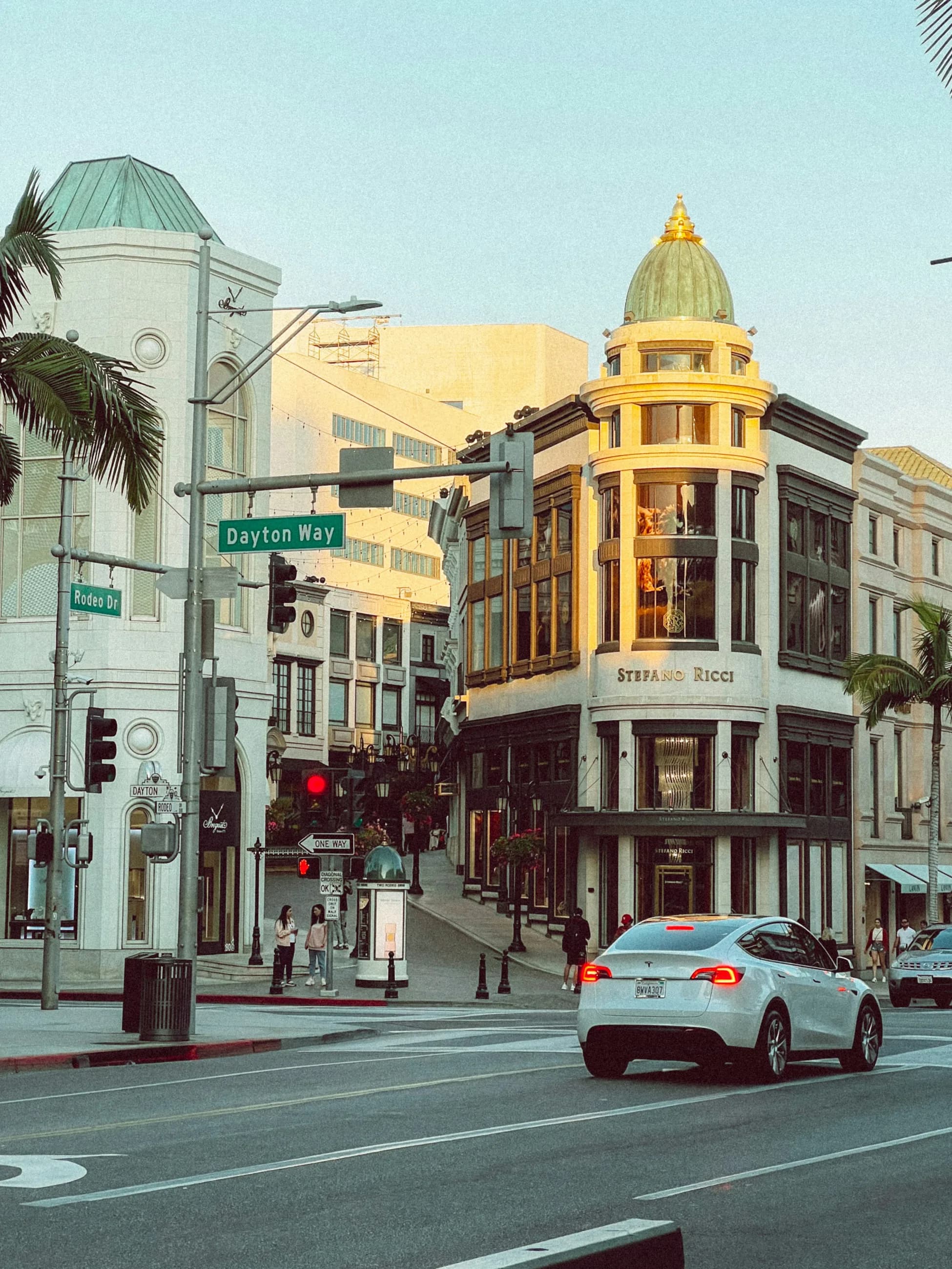 Rodeo Drive and Dayton Way beneath palms and historic commercial facades