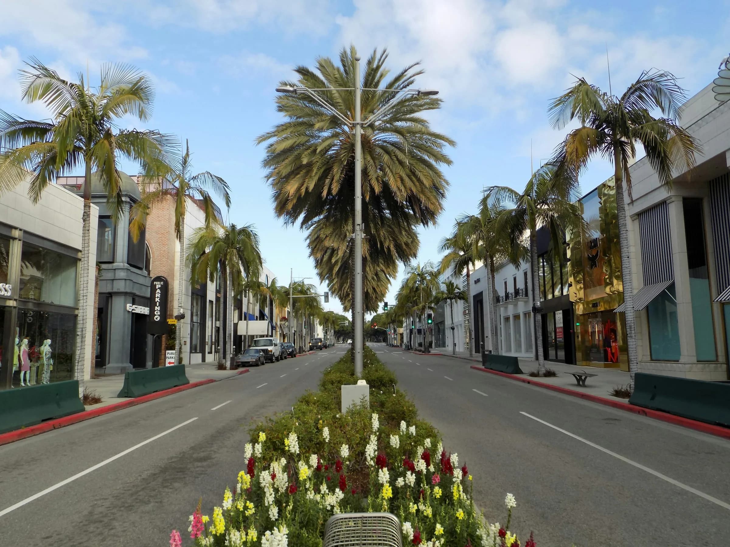 Flower beds and palms dividing a landscaped stretch of Rodeo Drive