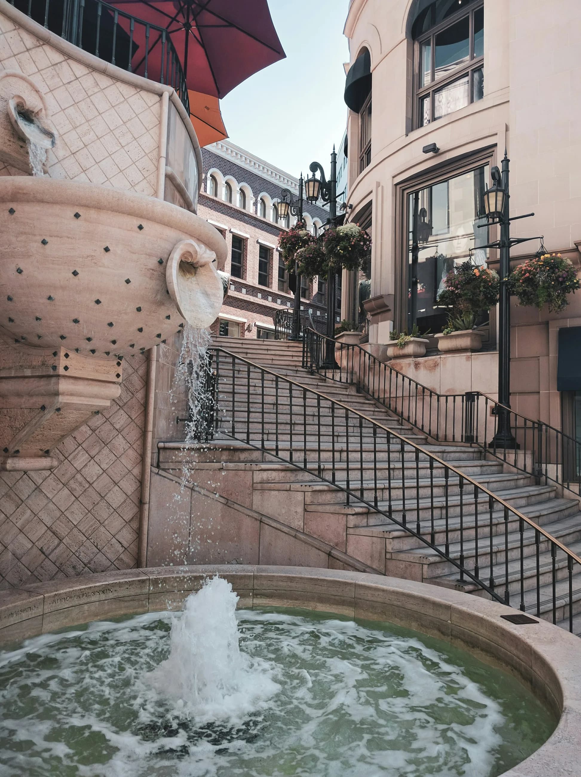 The Via Rodeo fountain and curved staircase