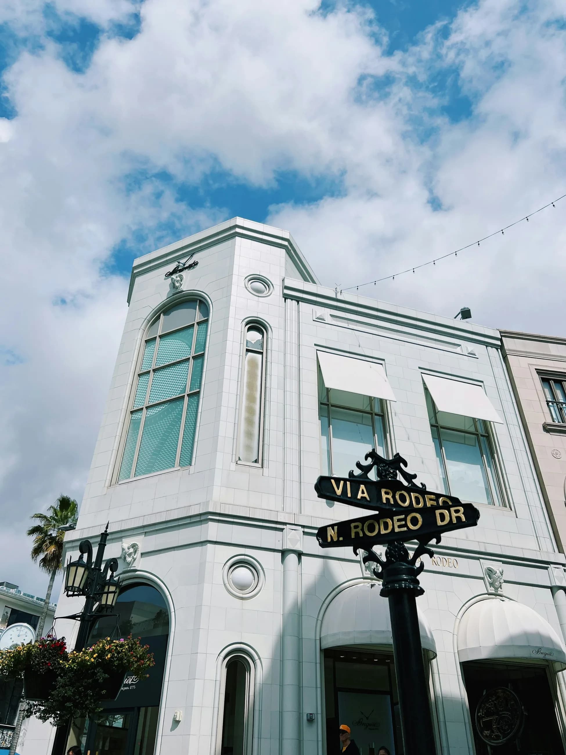 The Via Rodeo marker mounted on a white Beverly Hills facade