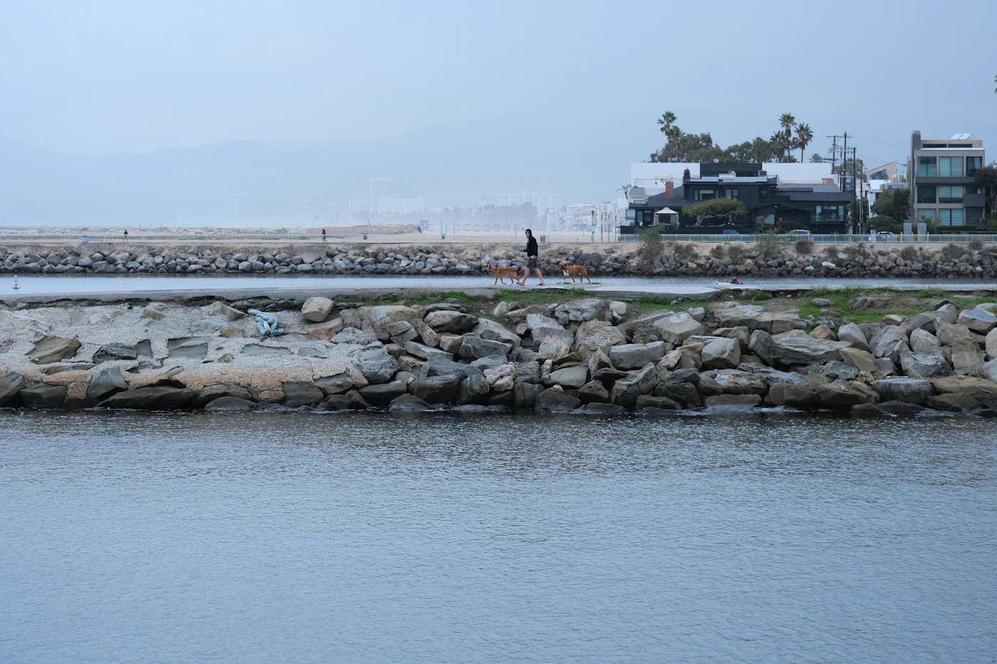 A waterfront walking path along the Marina del Rey breakwater