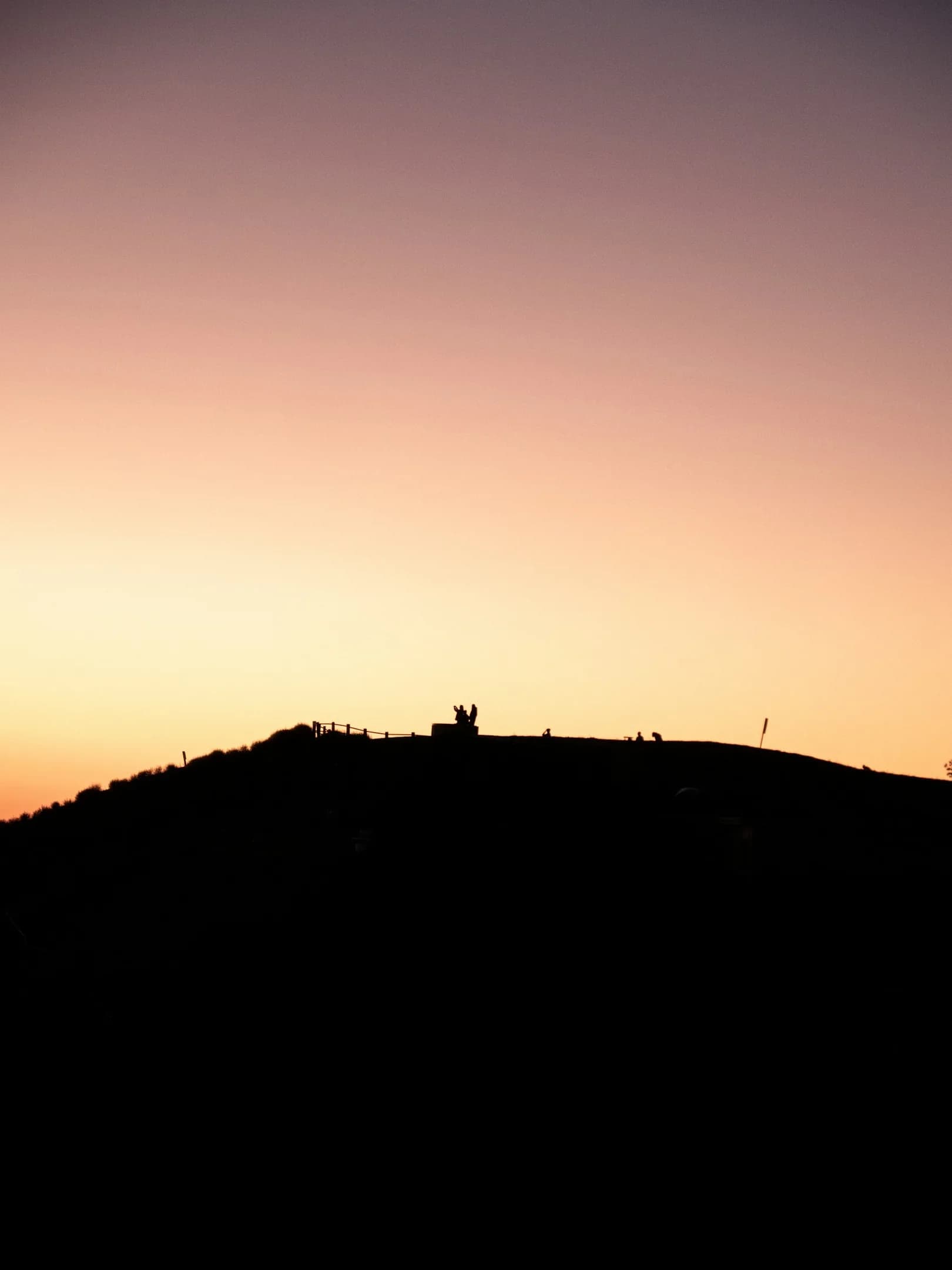 A hiker silhouetted on the ridgeline at Portuguese Bend Reserve