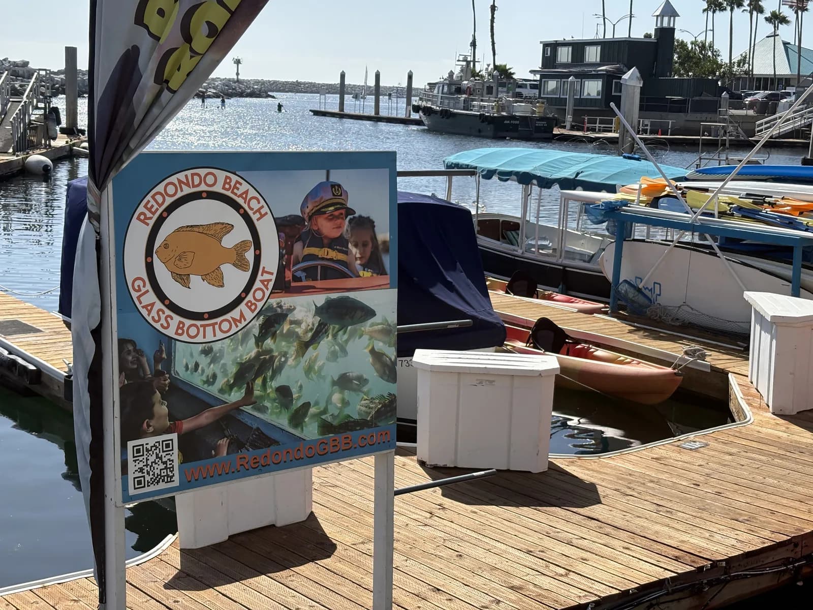 Glass-bottom boat excursion sign beside the King Harbor docks