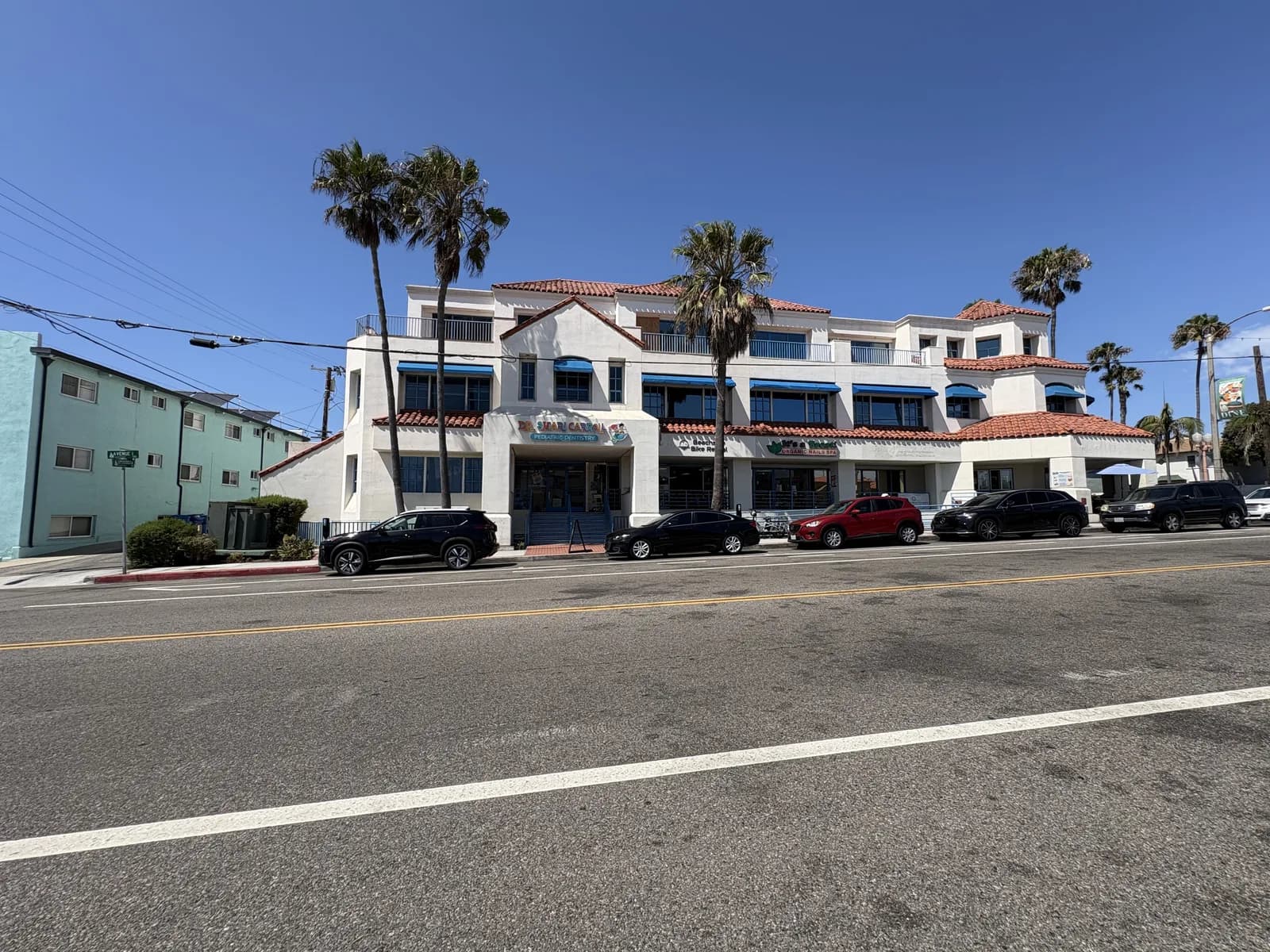 Mixed-use coastal block with neighborhood businesses and residences