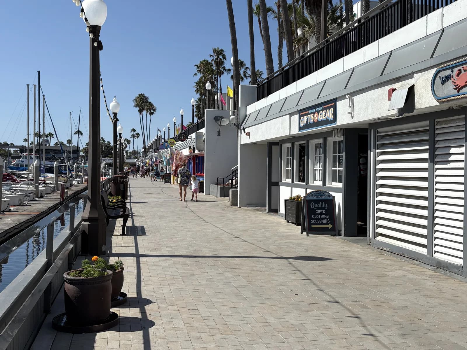 Waterfront storefronts and pedestrian path near the Redondo Beach Pier