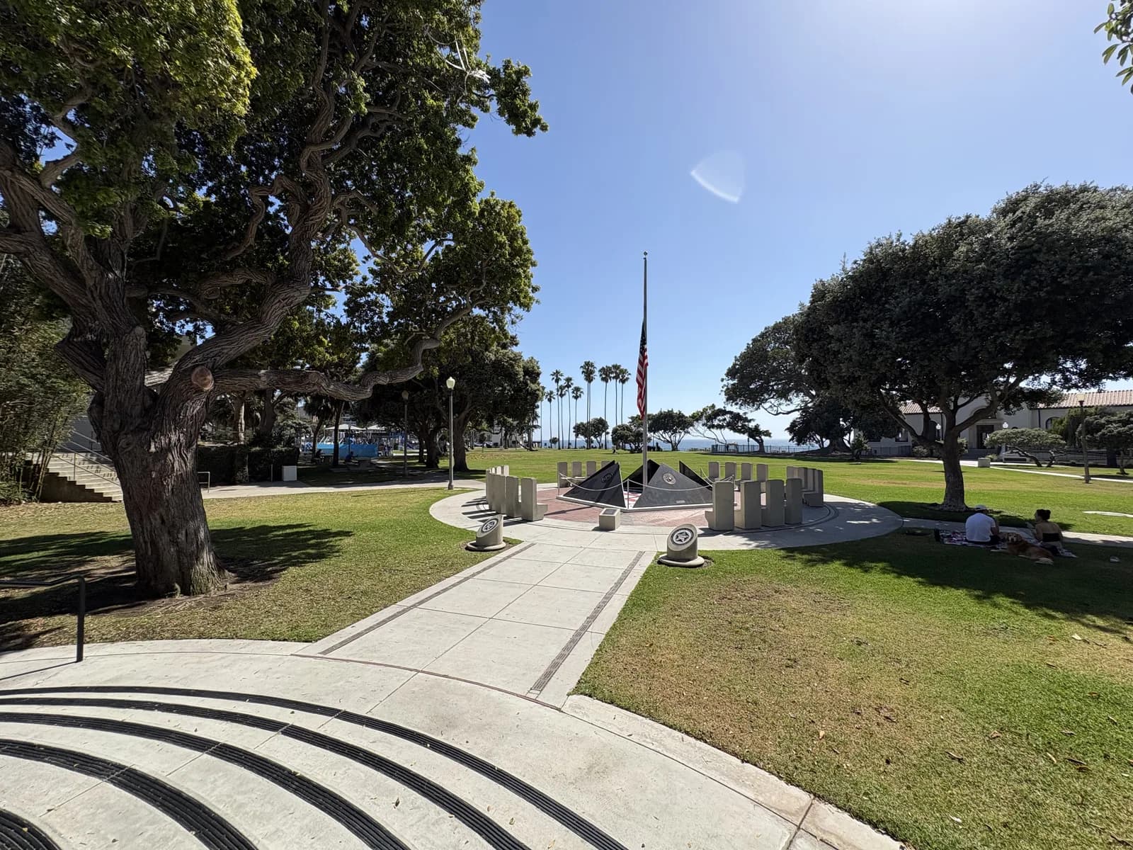 Open lawn and shaded paths at Veterans Park near the ocean