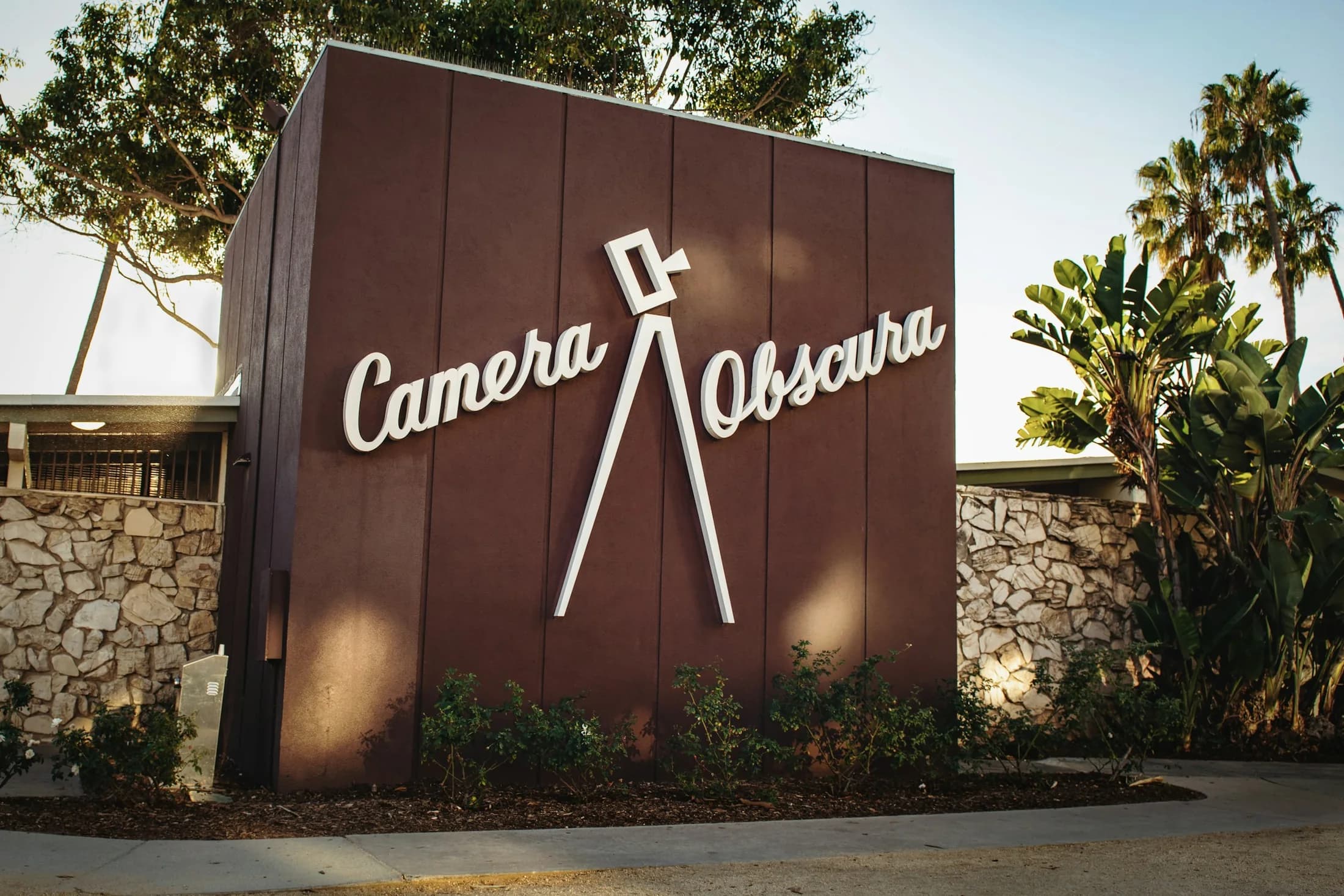 The Camera Obscura building and palms along Ocean Avenue in Santa Monica