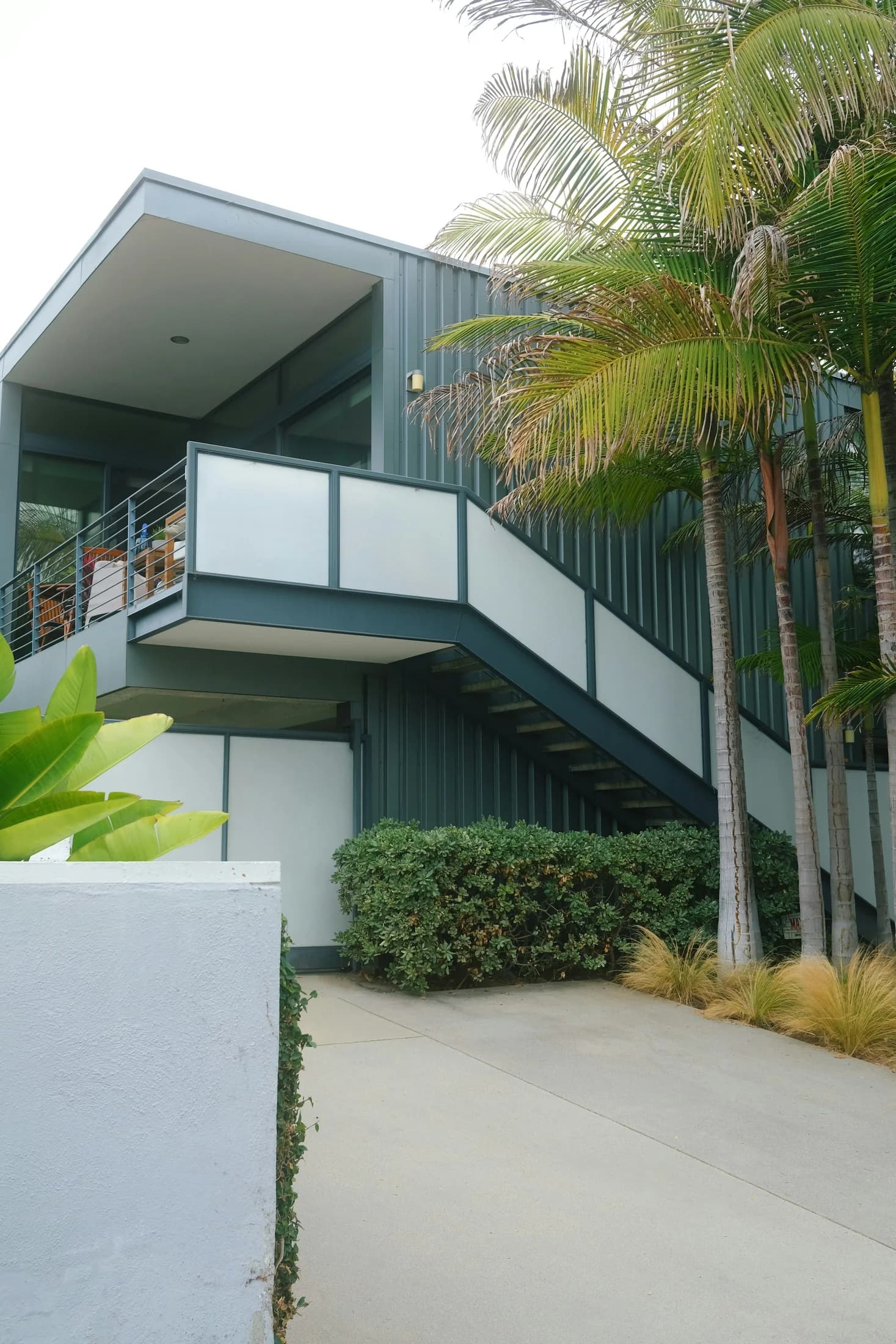 A contemporary home with palms and clean-lined balconies in Santa Monica