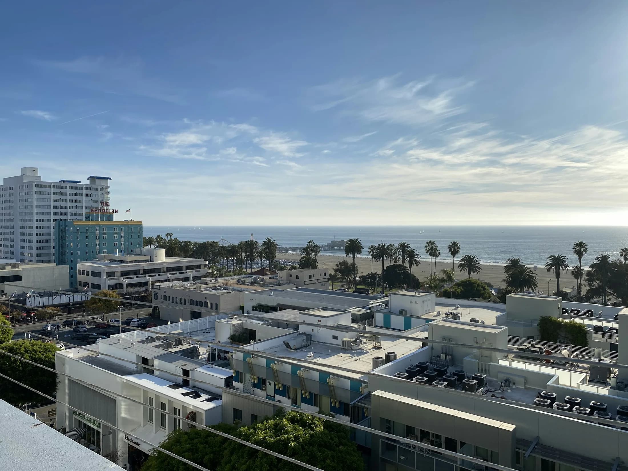 Aerial view across downtown Santa Monica toward the Pacific Ocean