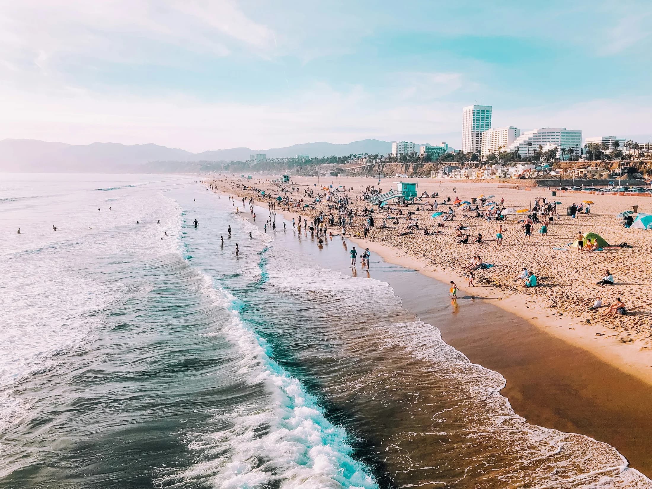 Beachgoers sharing Santa Monica Beach on a bright afternoon
