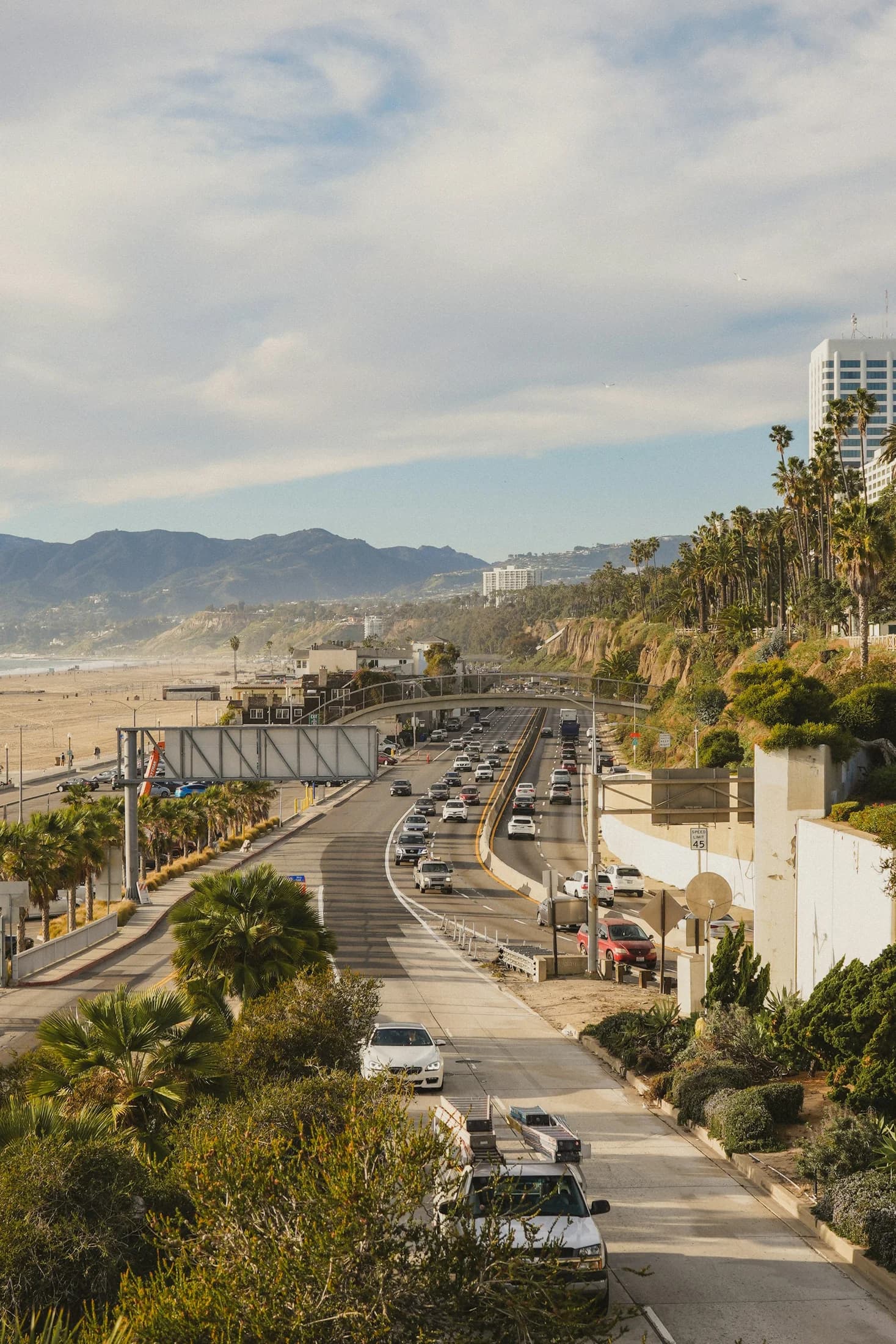 A coastal access road winding past Santa Monica neighborhoods toward the ocean