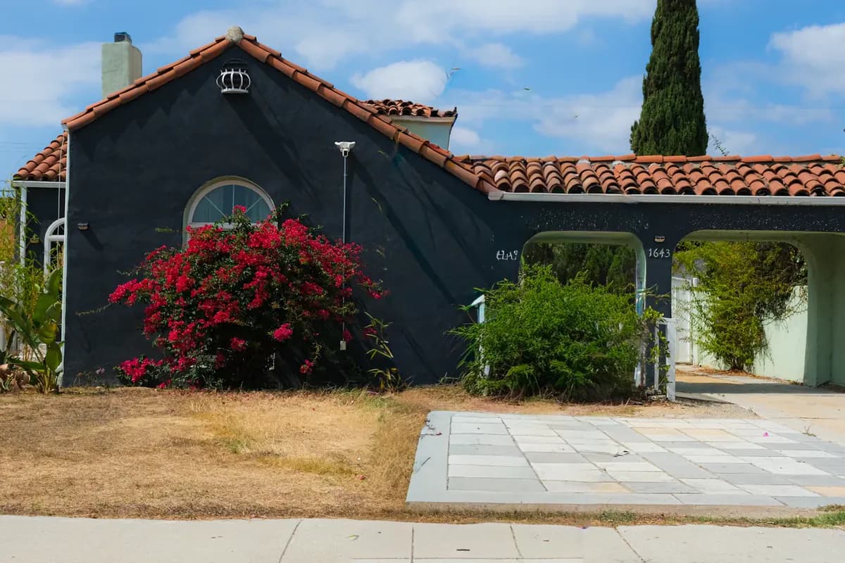 A dark stucco home with restrained contemporary details