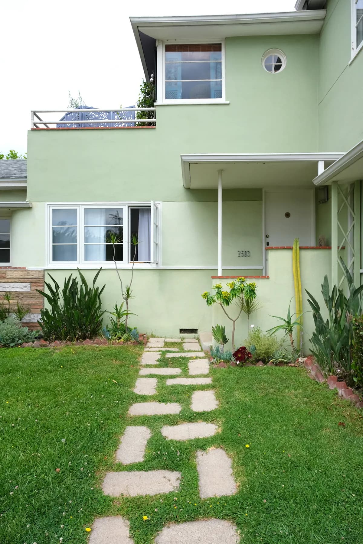 A green Southern California home with a welcoming front garden