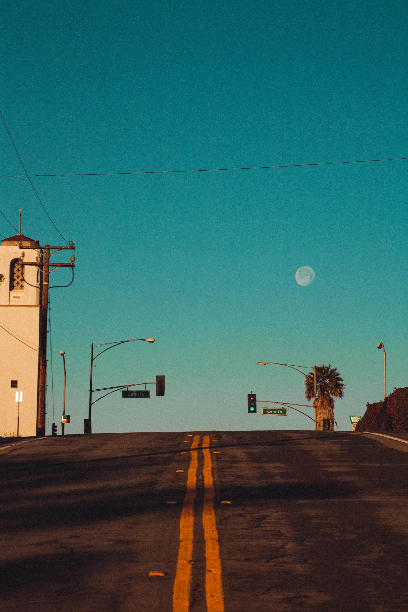 A quiet Southern California residential street at dawn