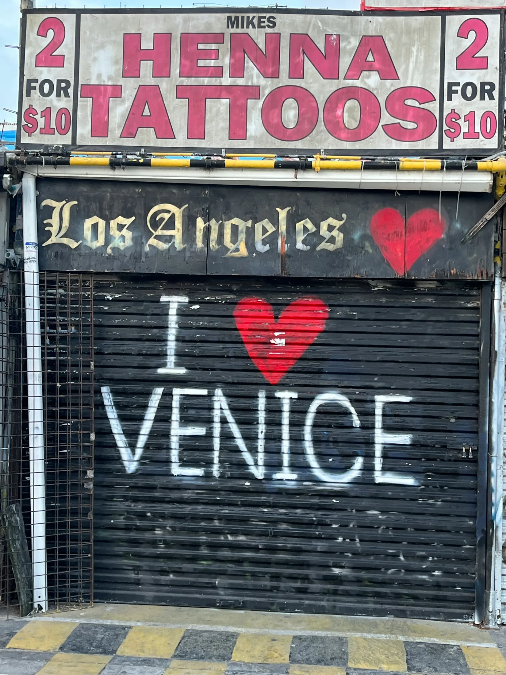 An I Love Venice artwork painted across a boardwalk storefront
