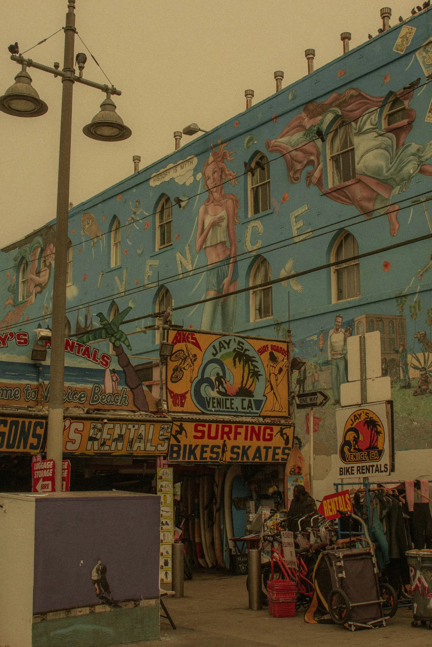 A Venice Beach storefront covered in a colorful architectural mural