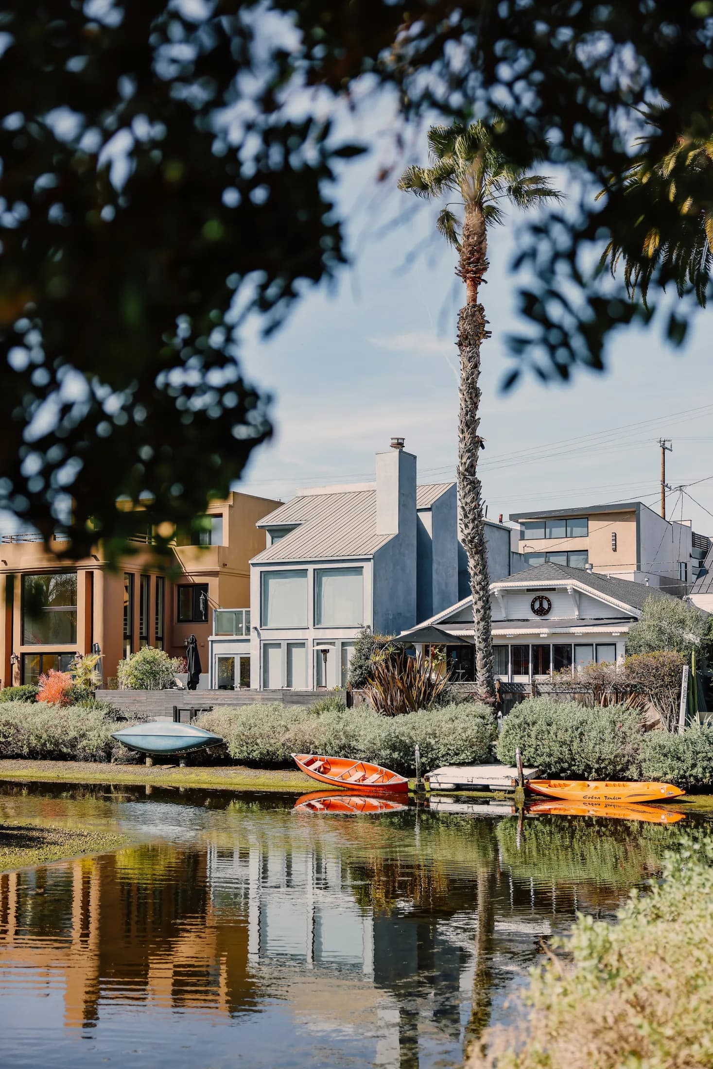 A row of distinctive homes facing the water in the Venice Canals