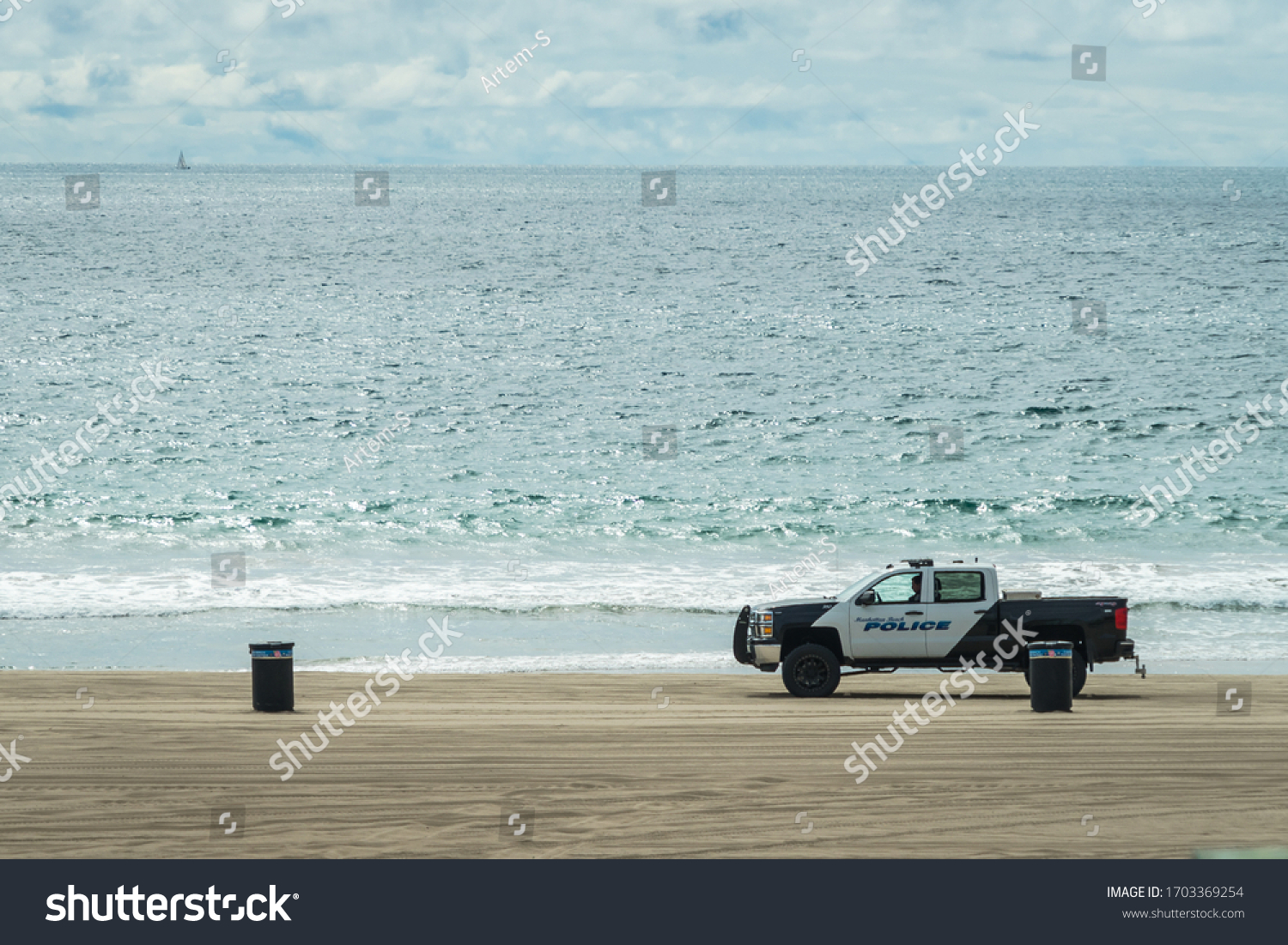 Manhattan Beach Police vehicle patrolling beside the ocean