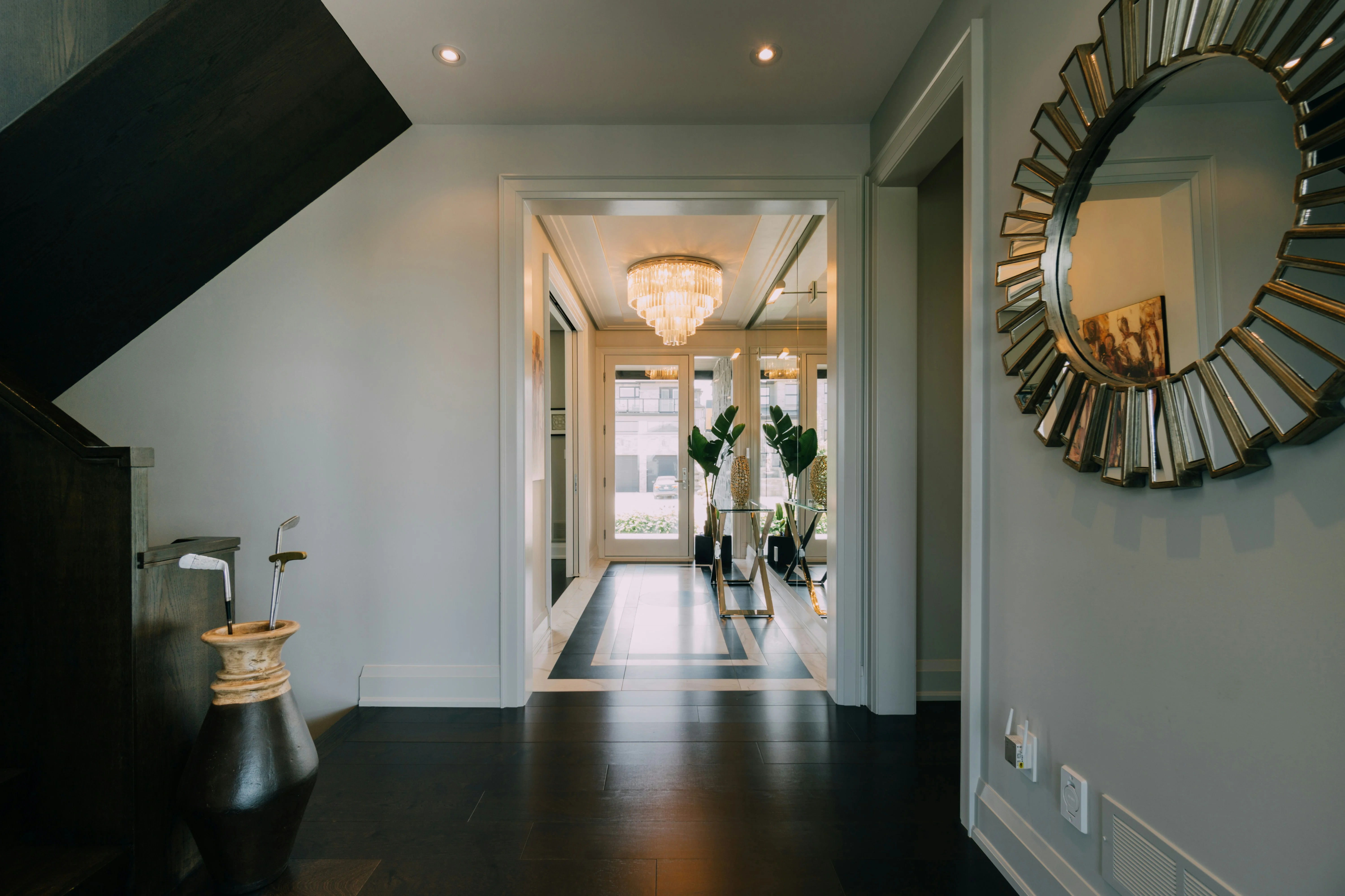 A refined residential entryway leading through an open doorway