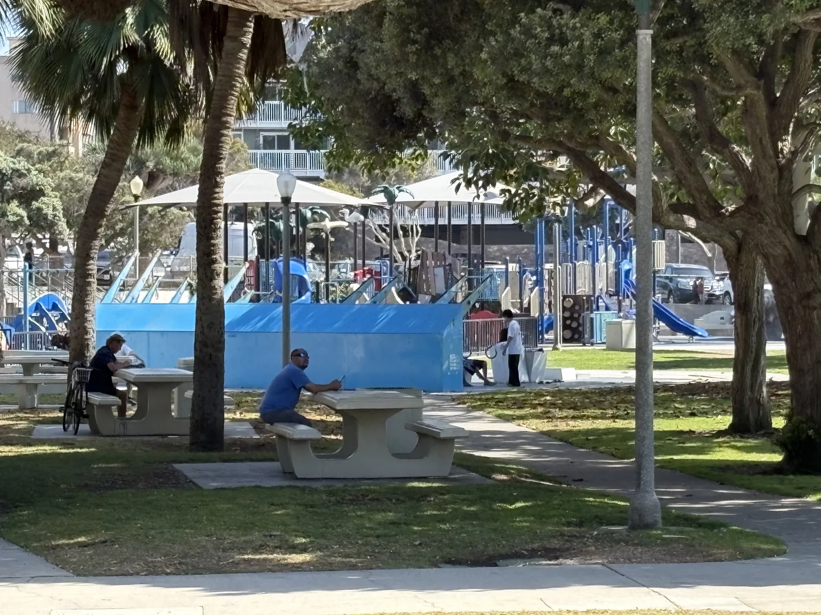 People gathering near a South Bay neighborhood playground